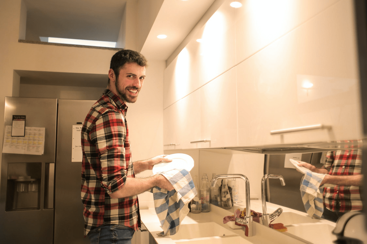 Smiling Man Washing Dish Plate