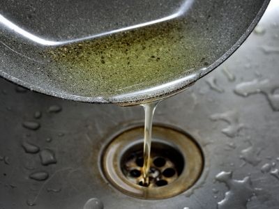 pouring gease into sink drain