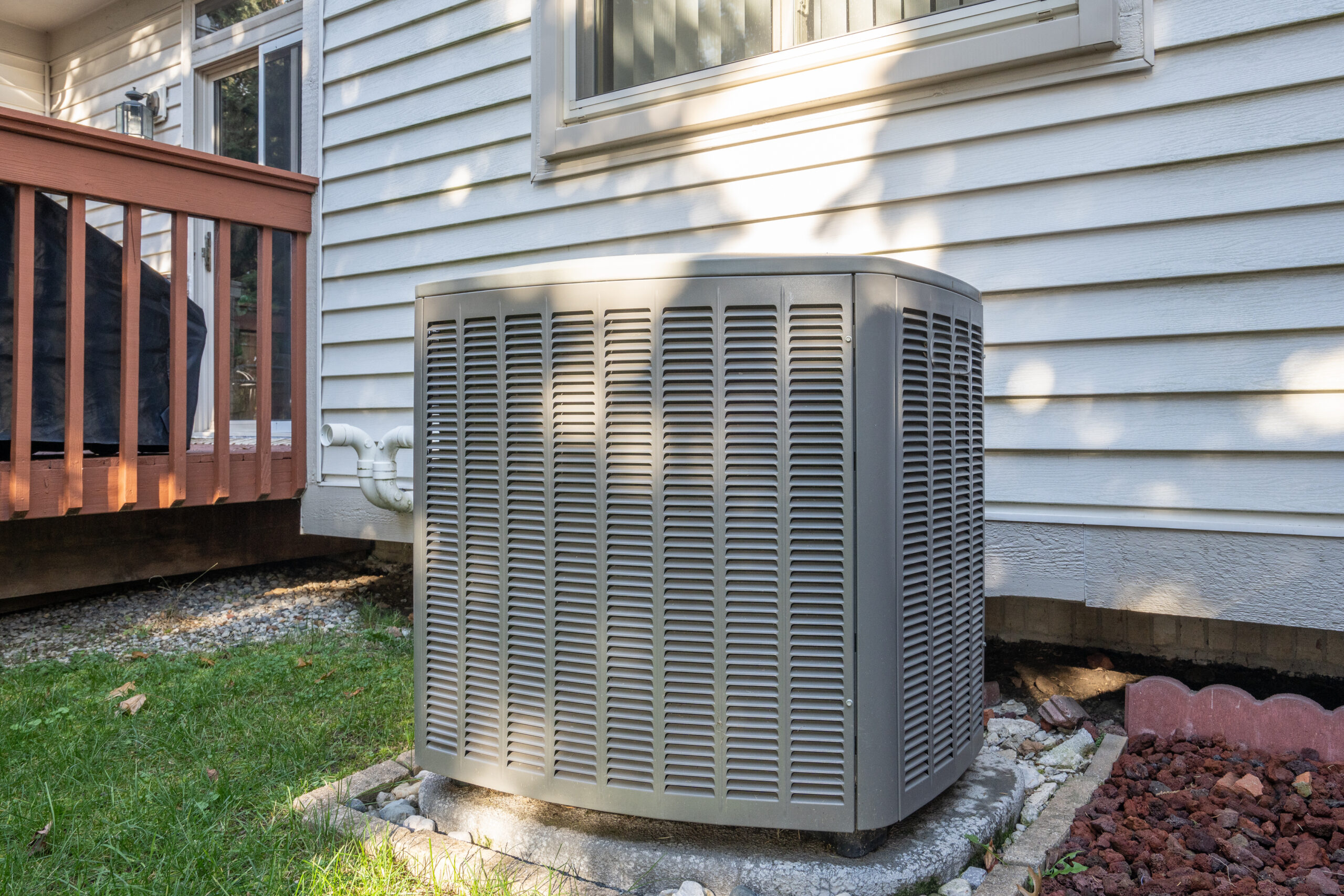 residential air conditioning unit in backyard